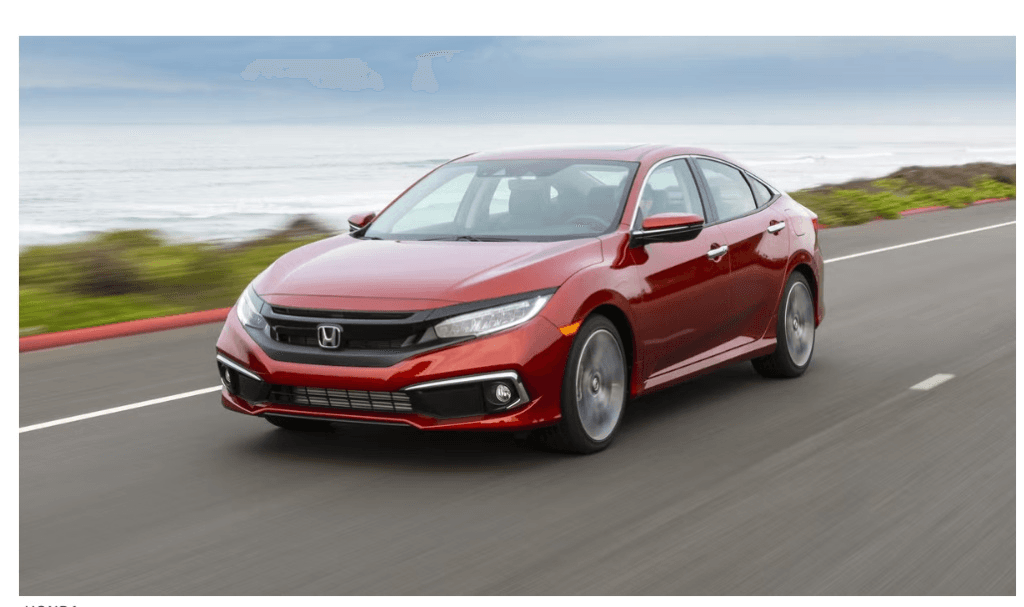 Metallic crimson Honda Civic sedan on a coastal highway
